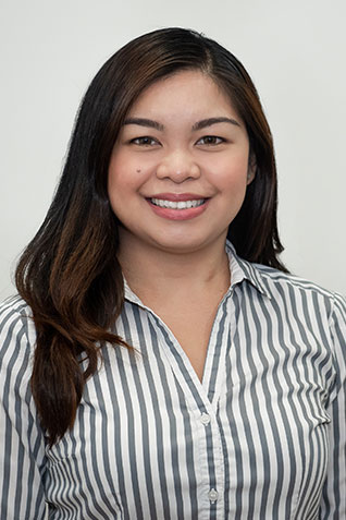 Sandra helping man with exercise equipment